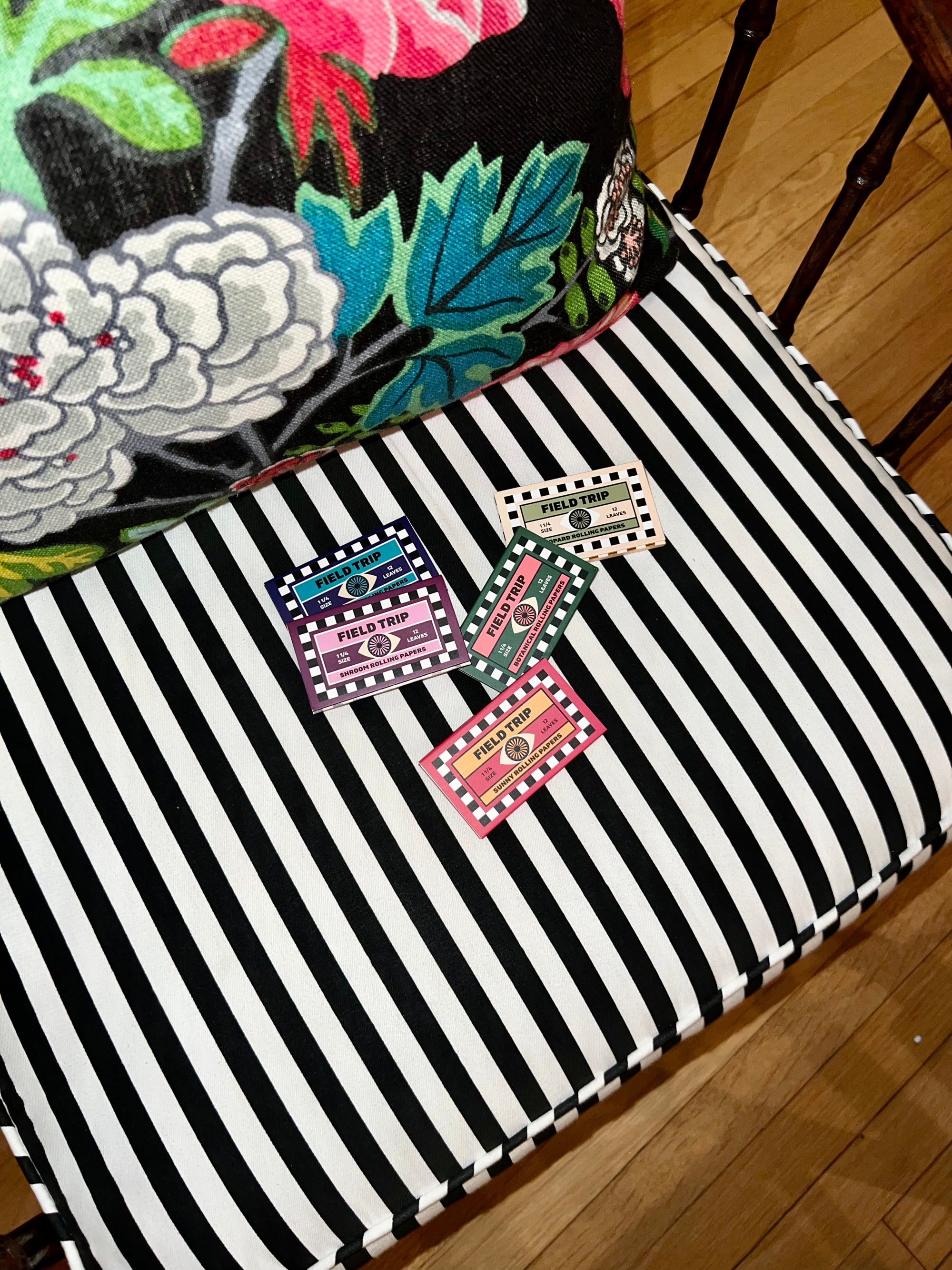 Rolling papers on a striped chair.